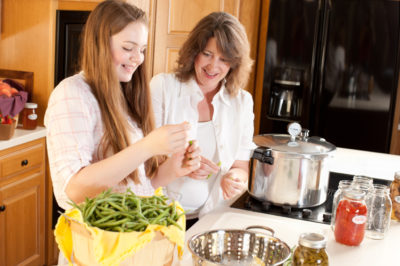 mother daughter canning vegetables