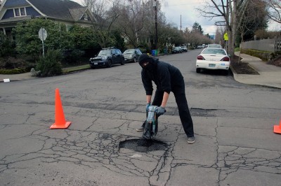 Masked Vigilantes Are Repairing A City’s Potholes – And Officials Are Upset 