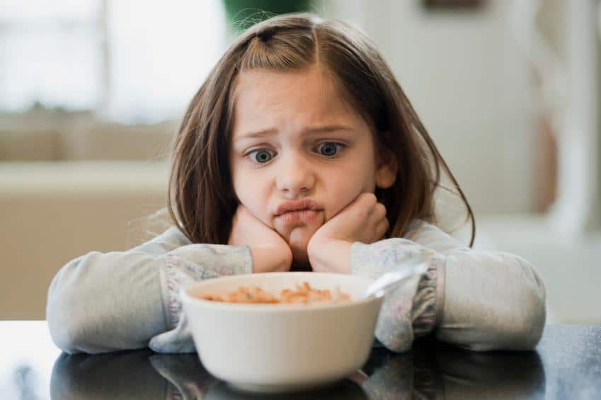 girl unhappy with GMO cereal