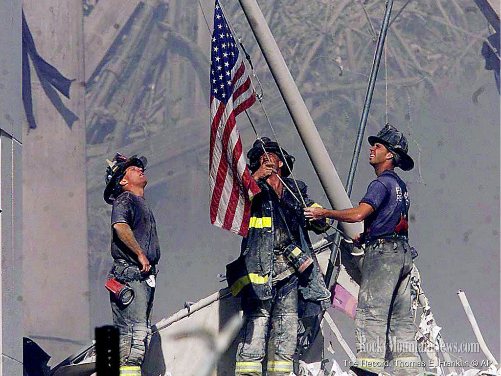 911 firefighters flag raising photo