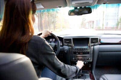 young woman driving  the car