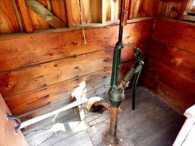Well pump attached to wind mill. Image source: Steve Nubia