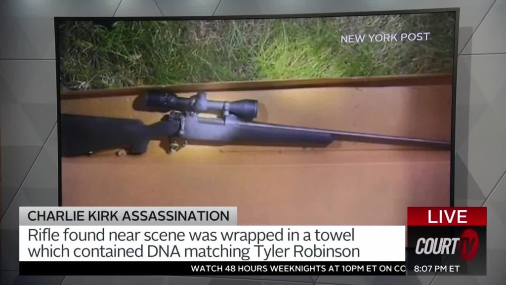 Court TV screen showing a scoped bolt-action rifle with a modern composite stock in a cardboard box
